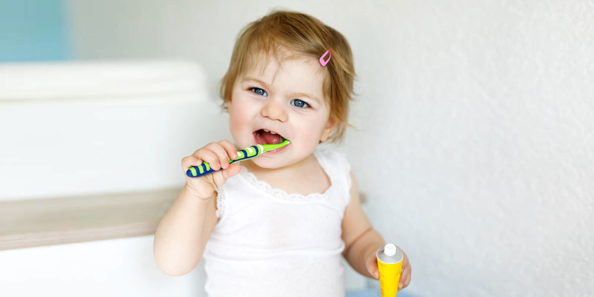 When & How to Brush Baby Teeth – Crawling Baby